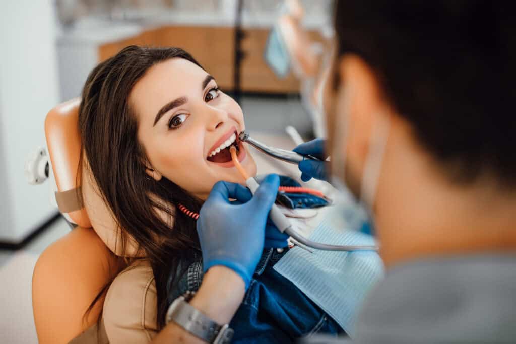 Young female patient visiting dentist office 1024x683 Wikileaks 5 smile friendly habits that extend the life of cosmetic dental procedures